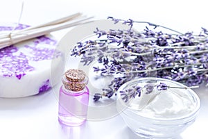 organic cosmetic with lavender flowers and oil on white background