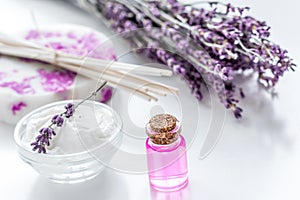 organic cosmetic with lavender flowers and oil on white background