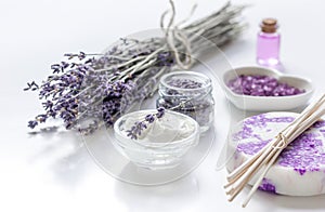 Organic cosmetic with lavender flowers and oil on white background