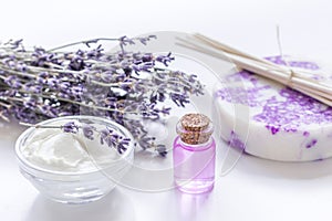 Organic cosmetic with lavender flowers and oil on white background