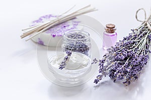 Organic cosmetic with lavender flowers and oil on white background