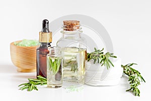 Organic cosmetics with extracts of herbs rosemary on white background