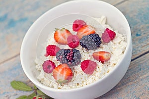 Organic cottage cheese with blackberry, strawberry and raspberry