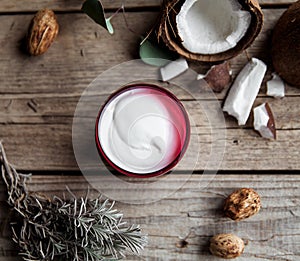 Organic cream on wooden background. Conditioner, shampoo for hair care. Natural cosmetics. Healthy skin and hair.