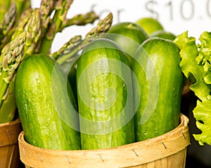 Organic Cucumber and asparagus in basket