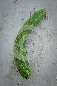 Organic cucumber on a wooden board