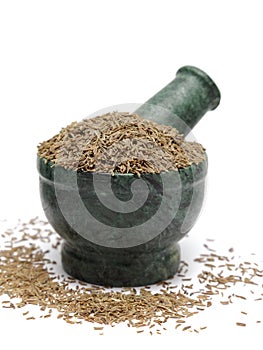 Organic Cumin seed (Cuminum cyminum) on marble pestle