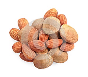 Organic dried apricot kernels on white background,
