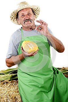 Organic farmer with a half honeydew melon