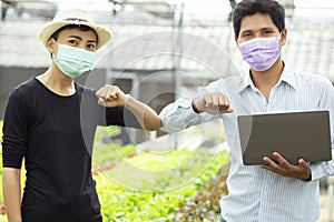 Organic farmer stands a great thumbs up