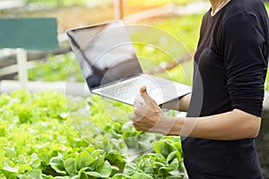 Organic farmer stands a great thumbs up