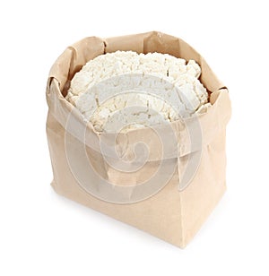 Organic flour in paper bag on white