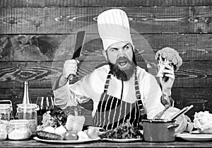 Organic food. Chef use fresh organic vegetables for dish. Vegetarian meal. Fresh ingredients only. Man bearded hipster