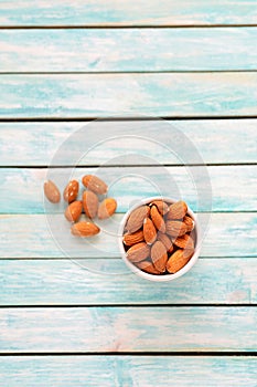 Organic Food. Nuts. Crude almonds on a vintage wooden table