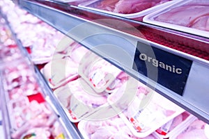 Organic food signage on modern supermarket fresh chilled meat ai