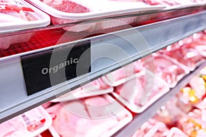 Organic food signage on modern supermarket fresh chilled meat ai