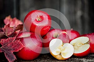 Organic fresh apples on wooden background in autum