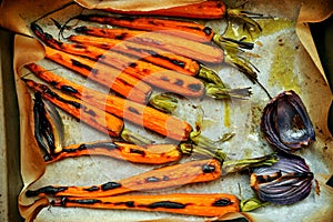 Organic , fresh carrots and onion grilled in the oven photo