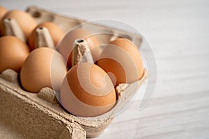 Organic fresh eggs in cardboard container pack with copy space, organic healthy food