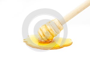 Organic fresh liquid honey with dipper isolated on white background