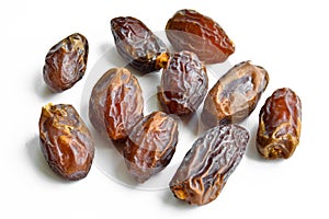 Organic fresh nutritious dried hurma dates medjool grains, on a white background