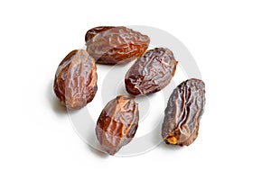 Organic fresh nutritious dried hurma dates medjool grains, on a white background