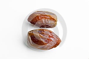 Organic fresh nutritious dried hurma dates medjool grains, on a white background