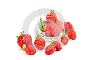 Organic fresh strawberries fruit in glass on white