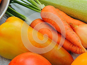 Organic fresh vegetables, ingredients for preparing food on linen tablecloth.