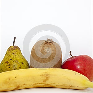 Organic fruits. Closeup apple, pear, kiwi, orange and banana on a white background with place for your text.