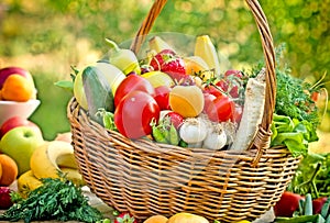 Organic fruits and vegetables in wicker basket