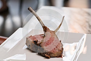 Organic Grilled Lamb Chops on white plate