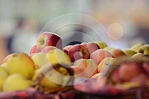 Organic grown apples in a basket with blown background