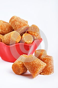 Organic Gur or Jaggery Powder and cubes, Jaggery is used as an ingredient in sweet and savoury dishes in the cuisines of India photo