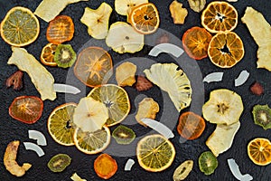 Organic Healthy Assorted Dried Fruit Close-up. Snacks from fraps: apple, pear, orange, banana, persimmon, coconut