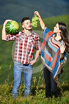 Organic and healthy. hippie couple with fruits. vitamin and dieting. summer food. man and woman hold watermelon. girl