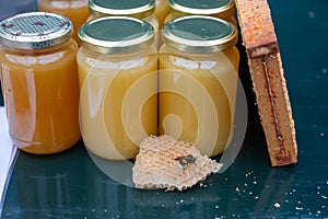 Organic honey from farm bee apiary on mountains meadows with summer wild flowers for sale in farm shop