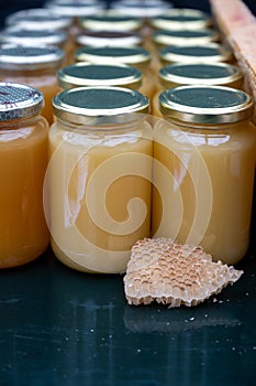 Organic honey from farm bee apiary on mountains meadows with summer wild flowers for sale in farm shop