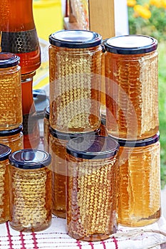 Organic honeycomb in jars on market