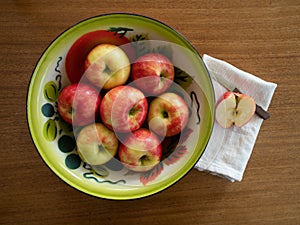 Organic Honeycrisp Apples in a Tin Bowl with a Half Apple and Pa