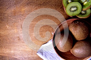 Organic Kiwi with a wooden background