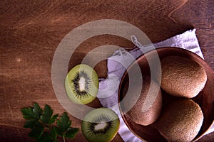 Organic Kiwi with a wooden background