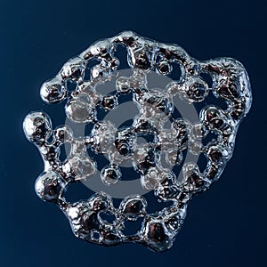 Organic-looking metallic structure with a complex network of interconnected nodes