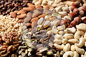 Organic mixed nuts as background, closeup.