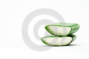 ORGANIC, NATURAL Aloe vera and kiw slice on white background, with copy space. (Aloe barbadensis Mill, Star cactus, Aloe