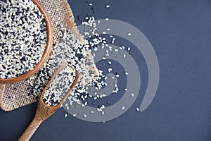 Organic natural sesame seeds wooden spoon. toasted sesame seeds. Raw, whole, unprocessed. Natural light. Selective focus