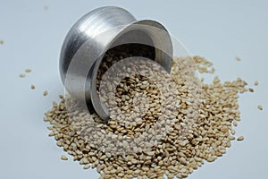 Organic natural Til Gul OR Sesame seeds over white background