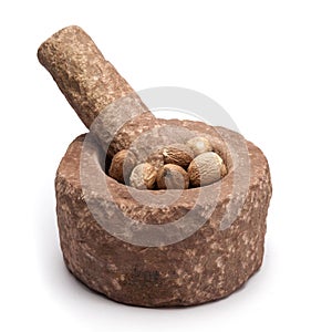 Organic Nutmeg Seed in mortar.