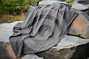 organic outlawed throw on a stone surface photo