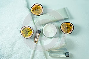 Organic passion fruit serum for skin care. Natural oil in a glass bottle, a container for white cream, natural cosmetics. Spa